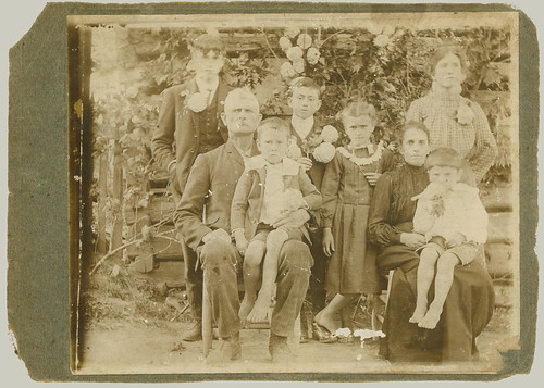 Card mounted photograph of family