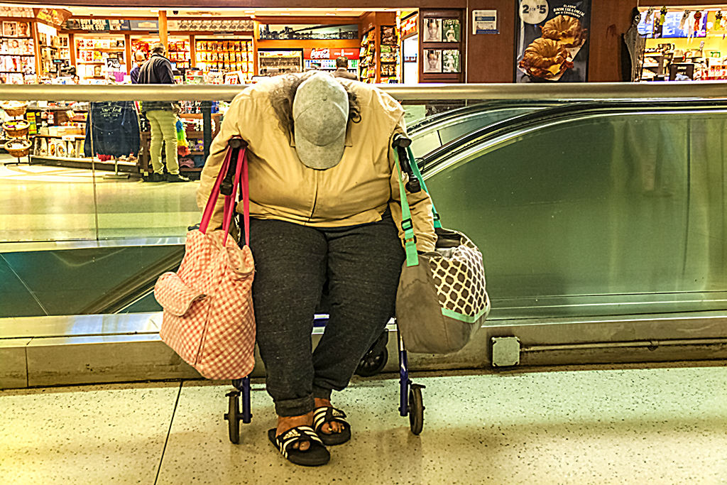 Woman slumped on wheelchair in Penn Station--Manhattan
