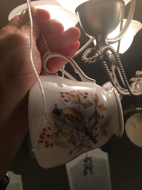 hanging the tea cup on the chandelier