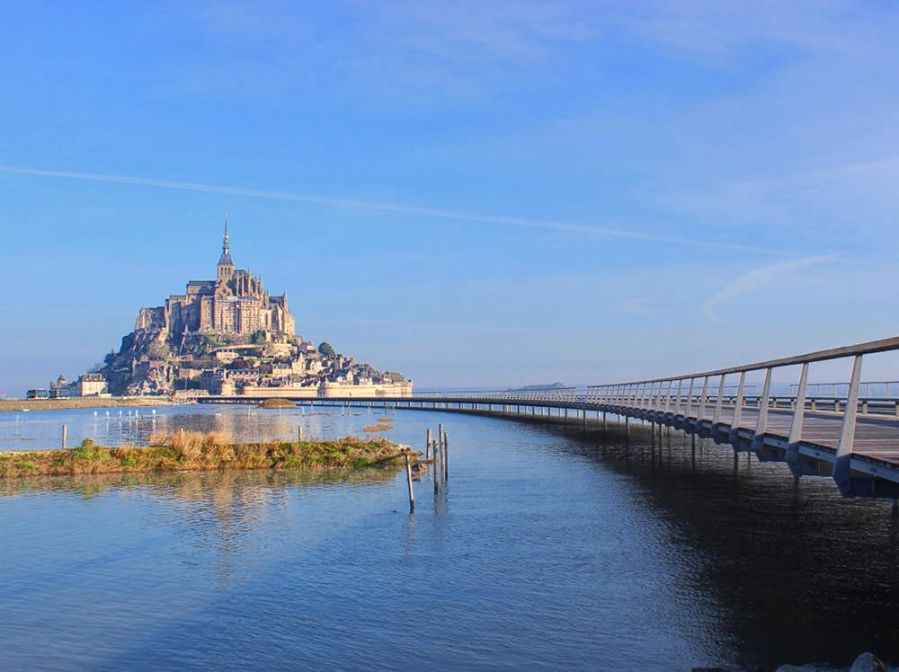 Mont Saint-Michel and its new light bridge at high tide. Credit Mathias Neveling
