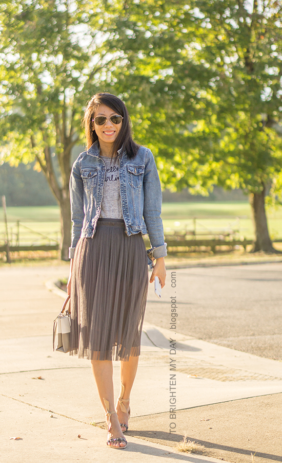 denim jacket, gray graphic tee, dark gray tulle midi skirt, colorblocked tote, suede sandals with jewels and ankle ties