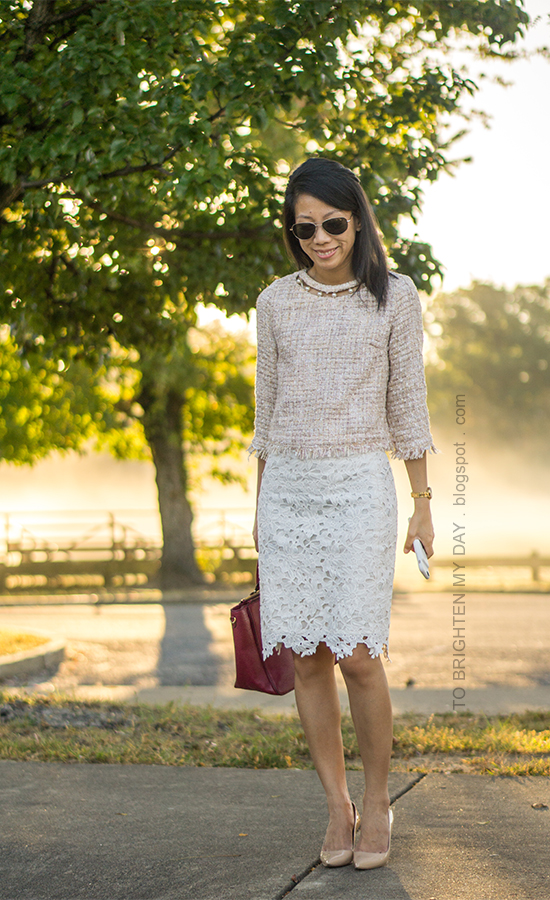 light pink tweed top with pearls, white lace pencil skirt, gold watch, burgundy tote, nude pumps