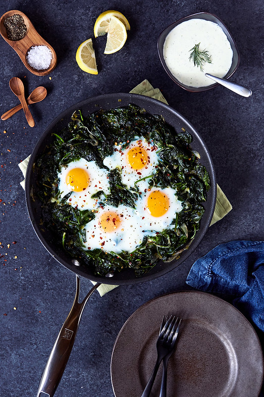 Skillet Baked Eggs and Greens with Herby Feta Yogurt Drizzle