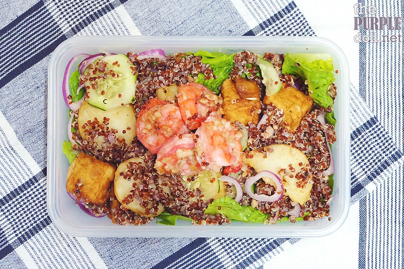 Quinoa, cucumber, red onions, potato crisp and greens salad with garlic shrimp and tofu