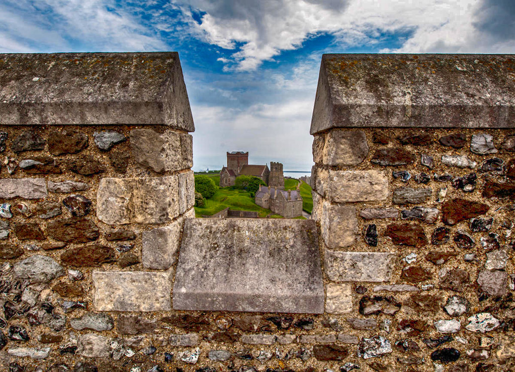 St Mary de Castro and Roman Lighthouse seen through an embrasure of the Dover Castle Keep, Dover, Kent, England. Credit Jim, flickr
