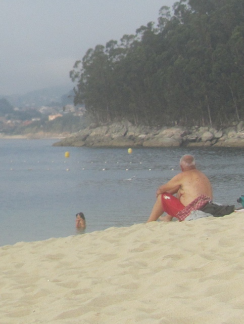 Old man watching a young couple