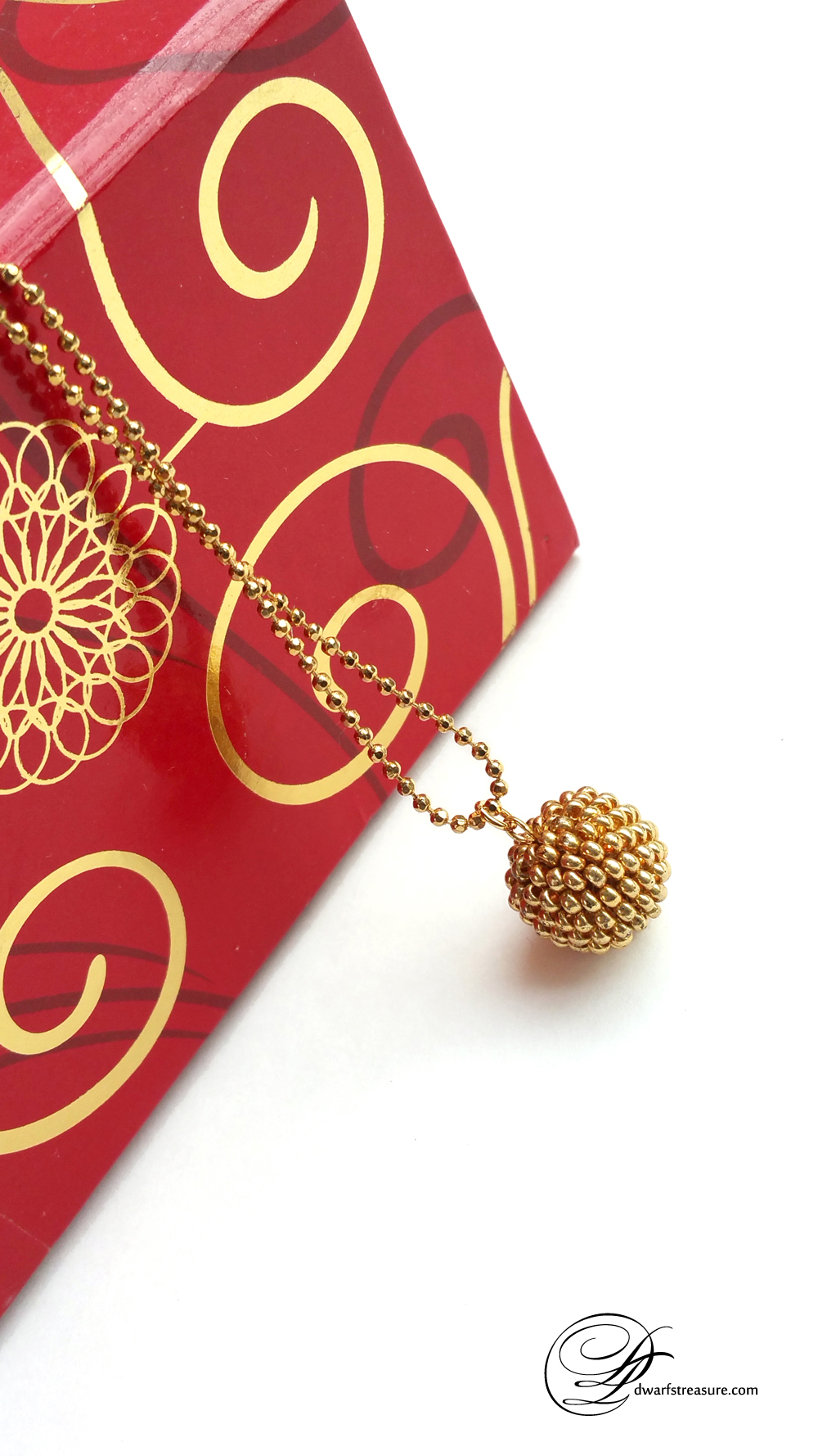 Exquisite gold glass bead ball charm