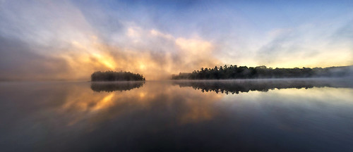 canada ontario muskoka lakes lake water calm reflection morning sunrise dawn fog clouds mist yellow colour landscape panoramatic pano blue tree island forest north america sun outdoor nature relax silent