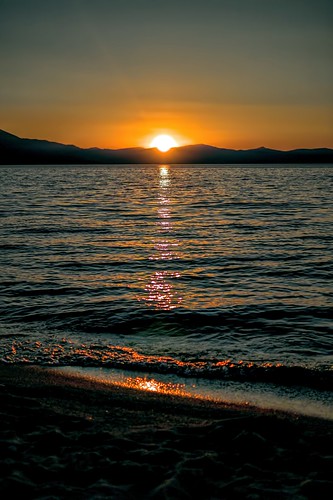 verticalsunset sunsetlake waves sand beach mountain lake orange blue yellow brown southlaketahoe inyonationalforest sierranevada california joelach