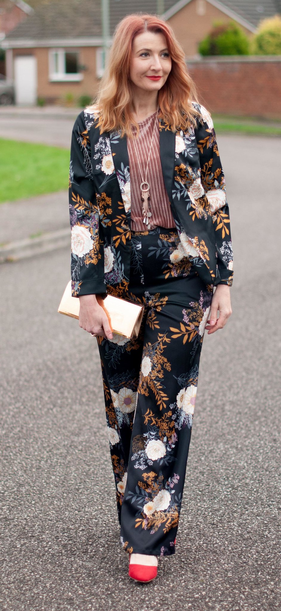 Floral pyjama pajama-style suit, Christmas party outfit: Trouser/pants suit with red heels, pink velvet top and gold mirror clutch | Not Dressed As Lamb, over 40 fashion