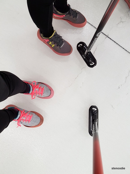  curling shoes and brooms