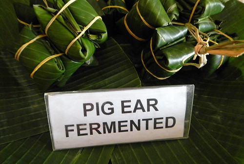 Banana-leaf-wrapped bundles of fermented pig's ear