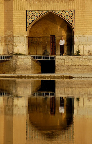 esfahan iran man reflection sunset evening travel holiday emotion before iranian bridge