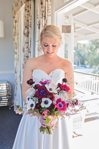 Jenna holding her wedding flowers.