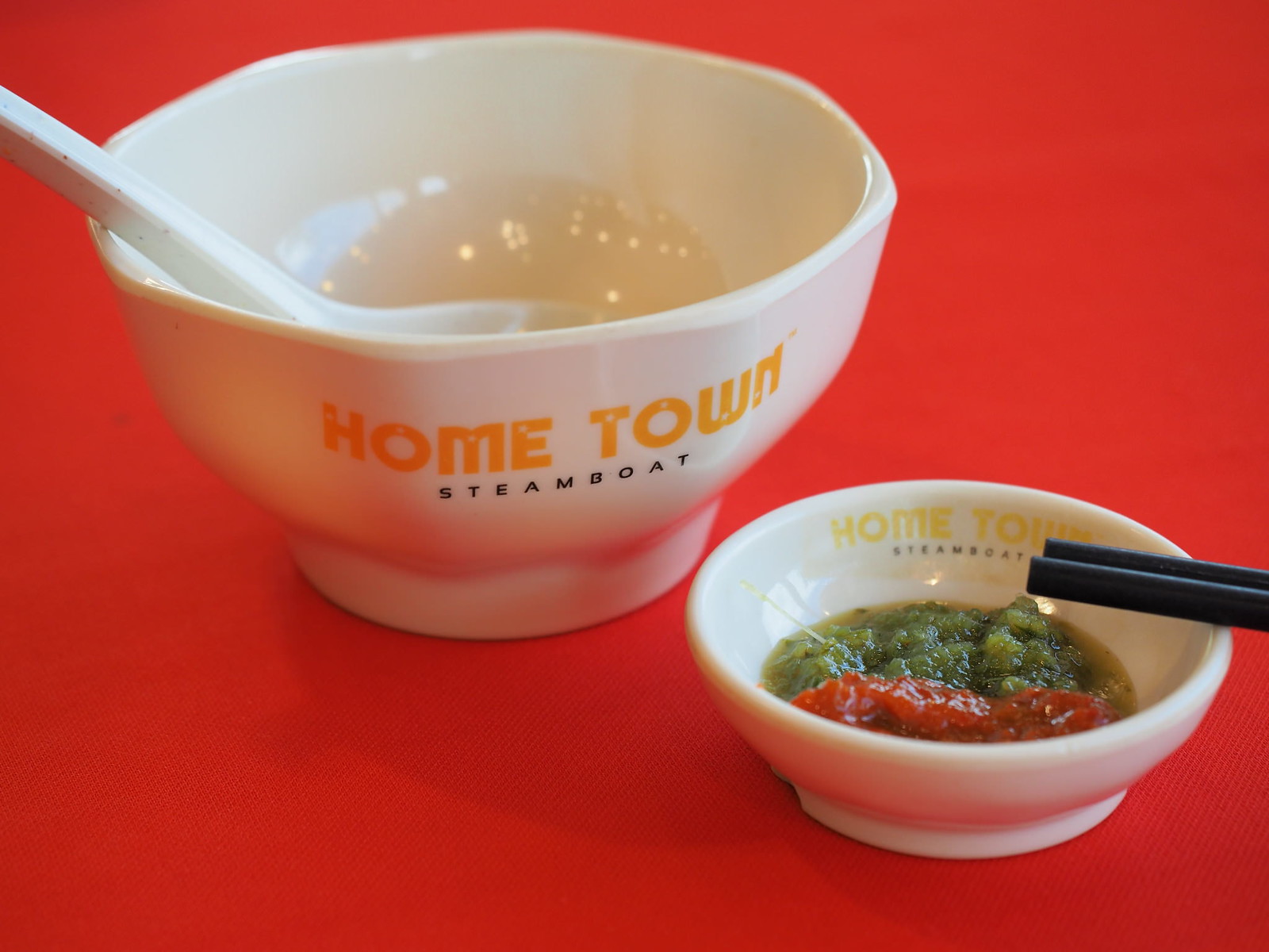 The bowl and the chili sauce for the steamboat