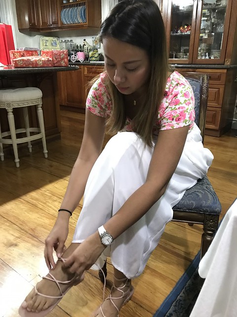 Yen putting on her sandals
