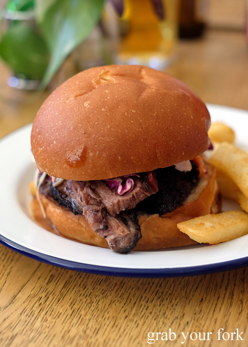 Brisket sandwich with chips at Hughes Barbecue at The George Hotel in Waterloo Sydney