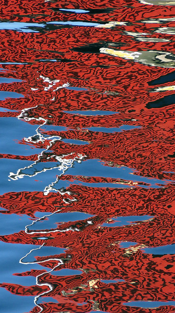 Red ripple reflection on the water at Horseshoe Bay in Canada