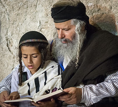 Jewish boy learning to pray at Western Wall