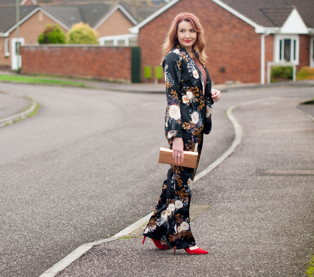 Floral pyjama pajama-style suit, Christmas party outfit: Trouser/pants suit with red heels, pink velvet top and gold mirror clutch | Not Dressed As Lamb, over 40 fashion