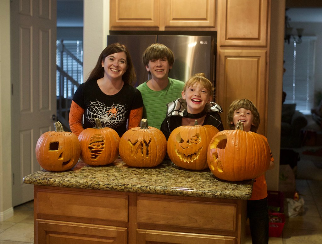family with carved pumpkins