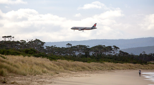 plane aircraft airplane sevenmilebeach tasmania beach person walking stroll flying