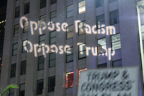 By Rob Wilson - Oppose racism- stop the GOP Tax Scam Buerrilla Light Projections by LA Solidarity Brigade