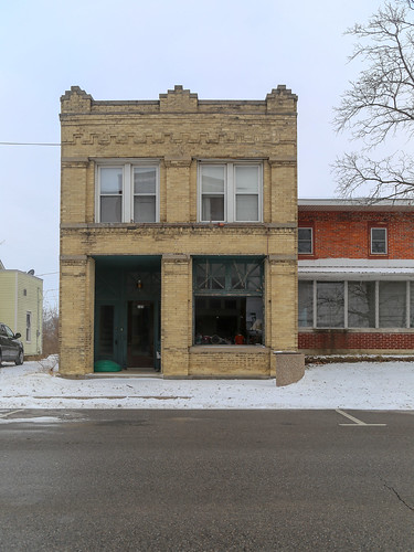 building structure commercial historic ney ohio defiance county twostory ca1910 buff brick paired windows 11 corbelling corbelled storefront inset vestibule pilasters capitals snow street
