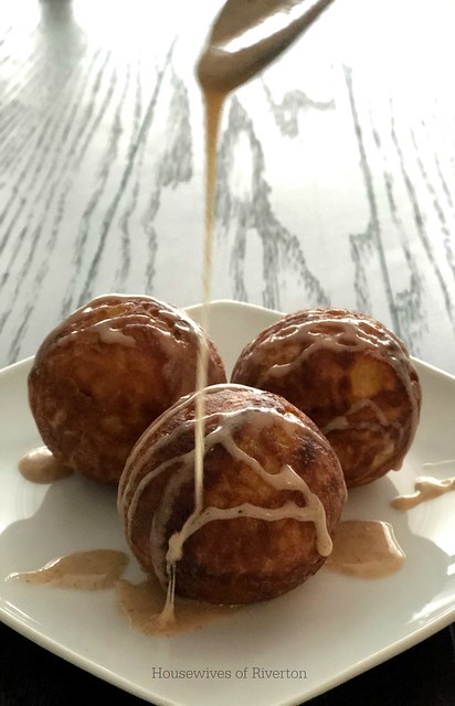 Make your winter morning perfect with these delicious Eggnog Aebleskivers for breakfast! Don't forget to drizzle them with our Eggnog Glaze! | www.housewivesofriverton.com