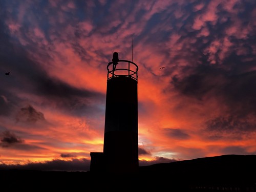 silhouette donegal ireland inishowen lighthouse pier buncrana sunrise
