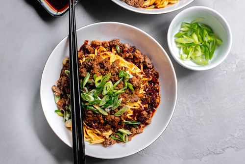Dan Dan Noodles: Spicy Szechuan Noodles with Chili Oil, ground beef (or ground pork) and topped with green onions.