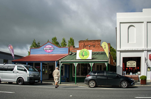 newzealand nikond750 southisland buildings lawrence tuapekadistrict town street people cars flags shops trees centralotago