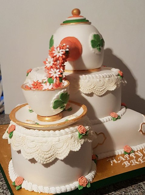 Teapot and bottom tier vanilla, fruit middle tier, lemon on the side. All edible! By Rosemary Williams of Roses Cake Box