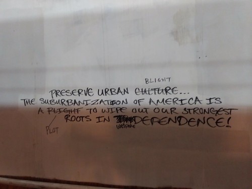 Graffiti in a construction walkway on the Metropolitan Branch Trail:  originally reading "Preserve Urban Culture... the Suburbanization of America is a plight to wipe out our strongest roots in independence