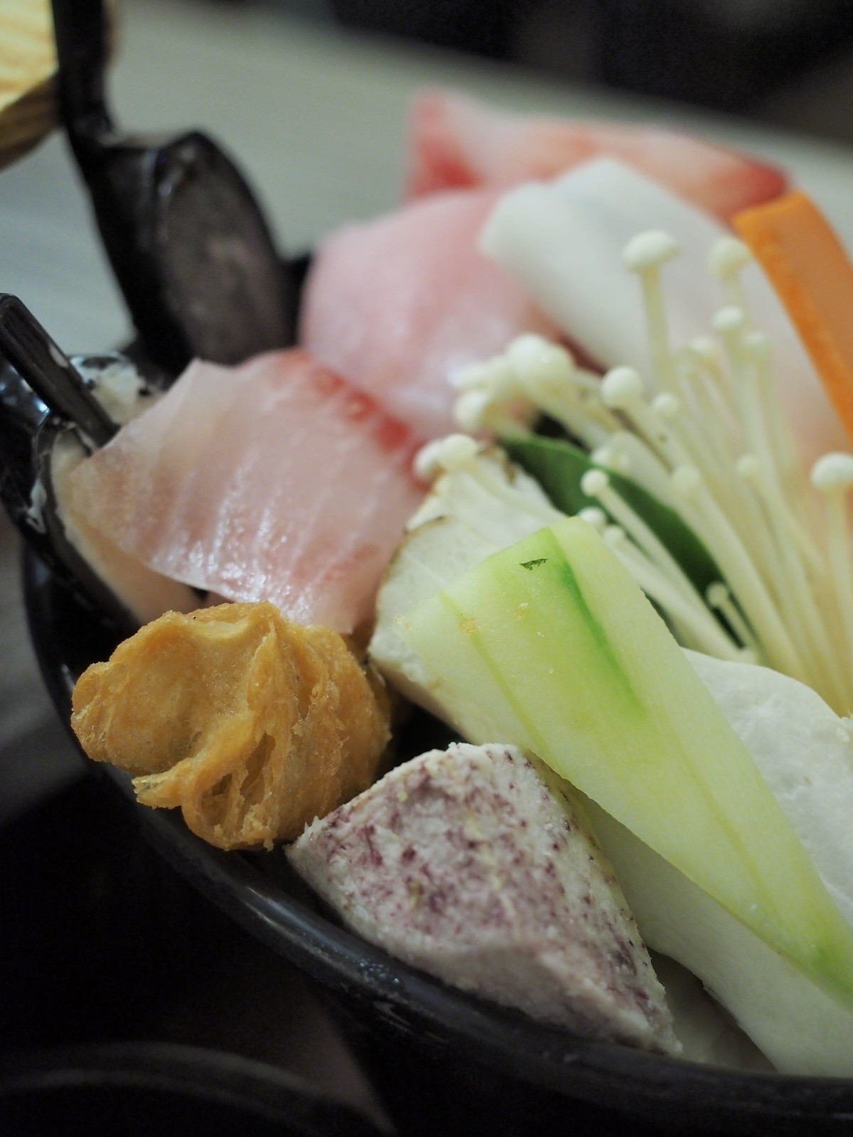 More ingredients such as fish slice, yam, enoki mushroom and cucumber