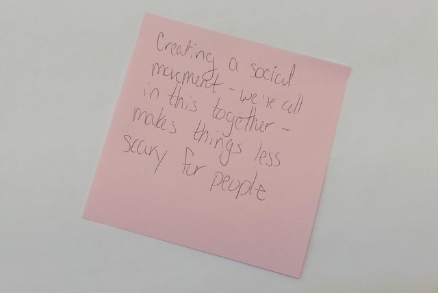 one sticky note with the message Creating a social movement - we're all in this together - makes things less scary for people