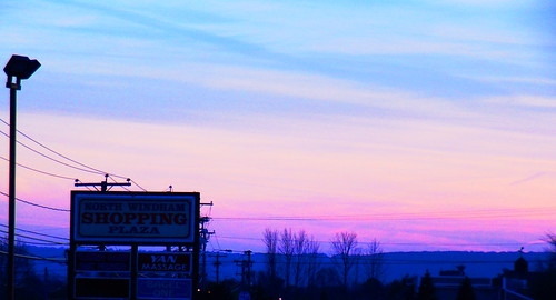 january 21 2018 connecticut sunset purple clouds north windham shopping plaza sign trees dusk