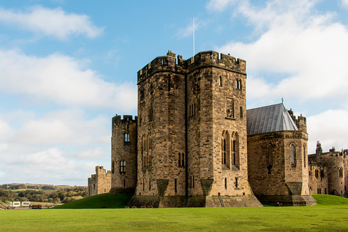 alnwick castle tower fort building architecture battlement grass field lawn landscape stone wall northumberland