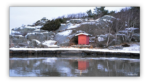 january winter cold sea water snow pier calm beach house shed rocks