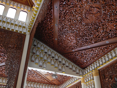 Intricately carved wood ceiling in a temple in Penang, Malaysia