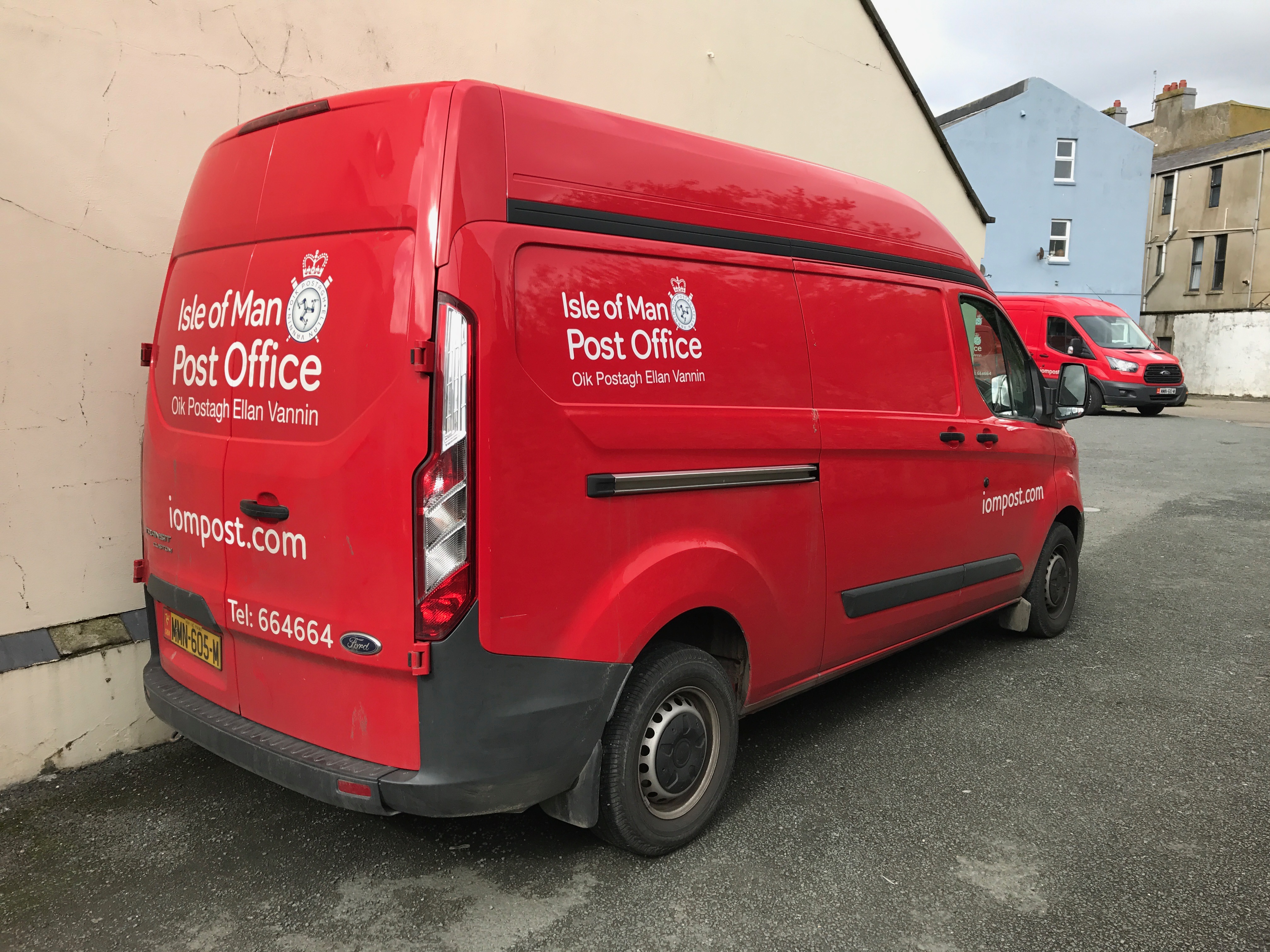 Two delivery vehicles of the Isle of Man Post Office (Oik Postagh Ellan Vannin) in the Post Office yard at Peel. Photo taken on September 5, 2017.
