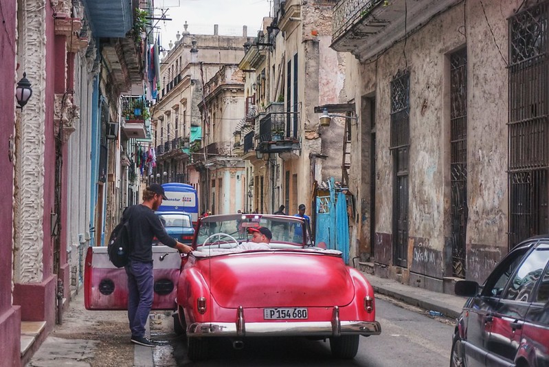 A man gets into a vintage car in Havana, Cuba