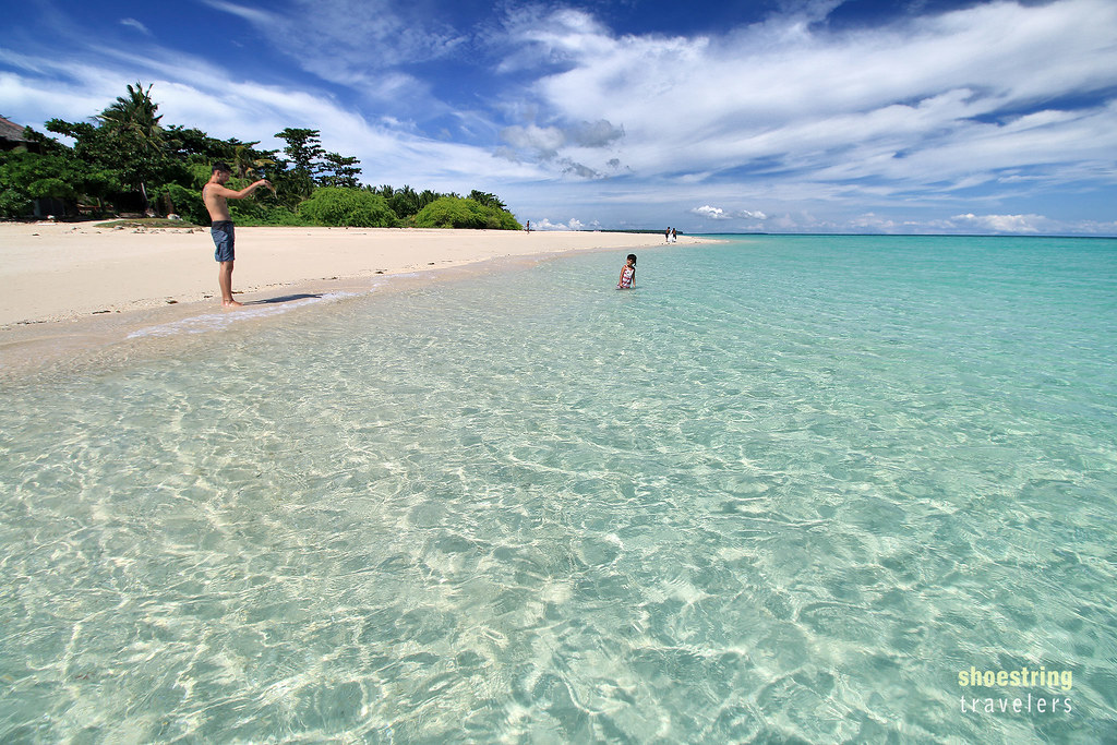 white sand and crystal-clear turquoise waters at Kota Beach