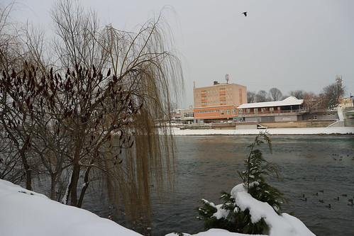 winter sanski most bosnia balkans snow cold ice landscape buildings hotel trees ducks birds plants