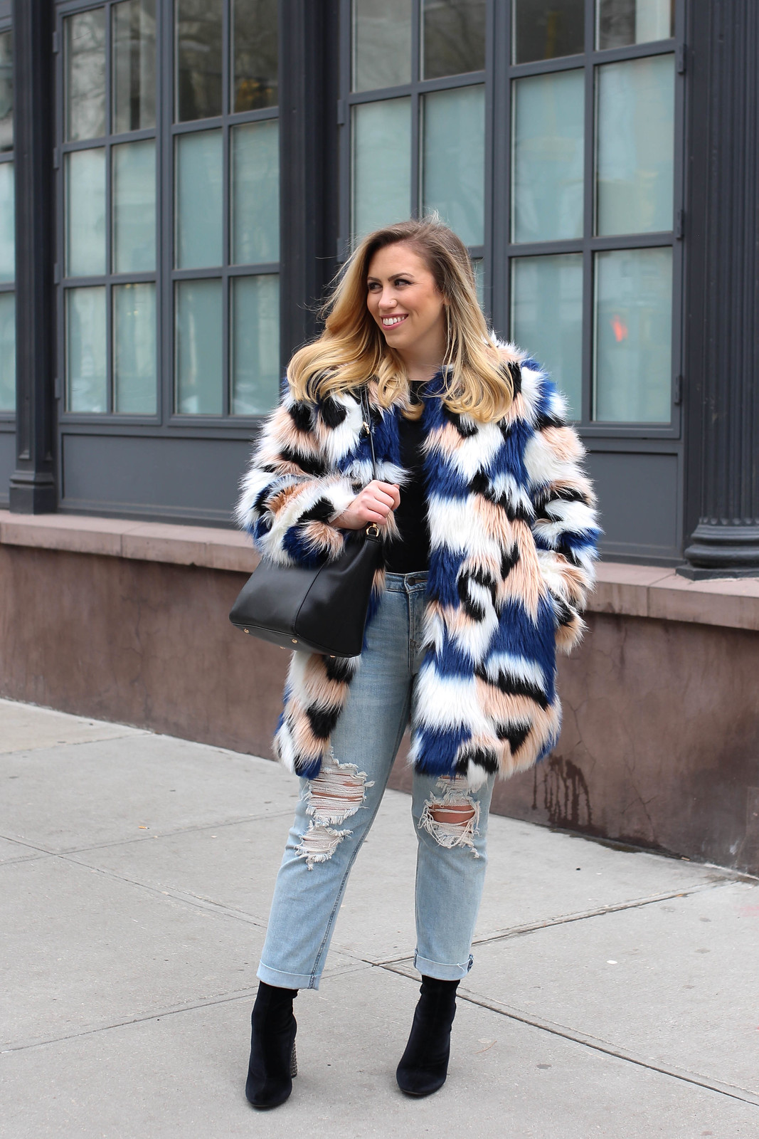 End of Winter Outfit Colorful Fur Coat Light Wash Distressed Jeans Black Sock Booties How to Get Excited by Your Own Wardrobe