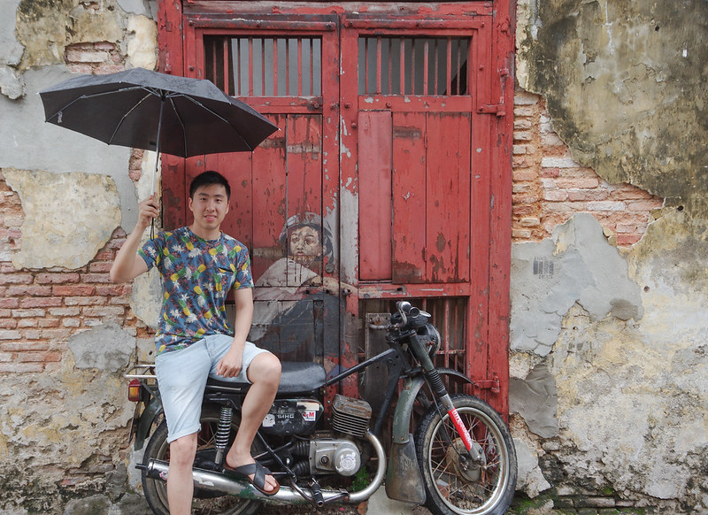 boy on motorbike street art in penang