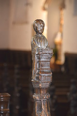 stall finial: priest reading at a lectern (15th Century)
