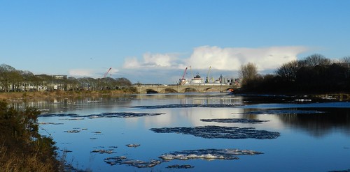 river dee ice float by blue sky water still calm clouds white victoria bridge torry low view wide shades shadows north east coast scotland city allanmaciver