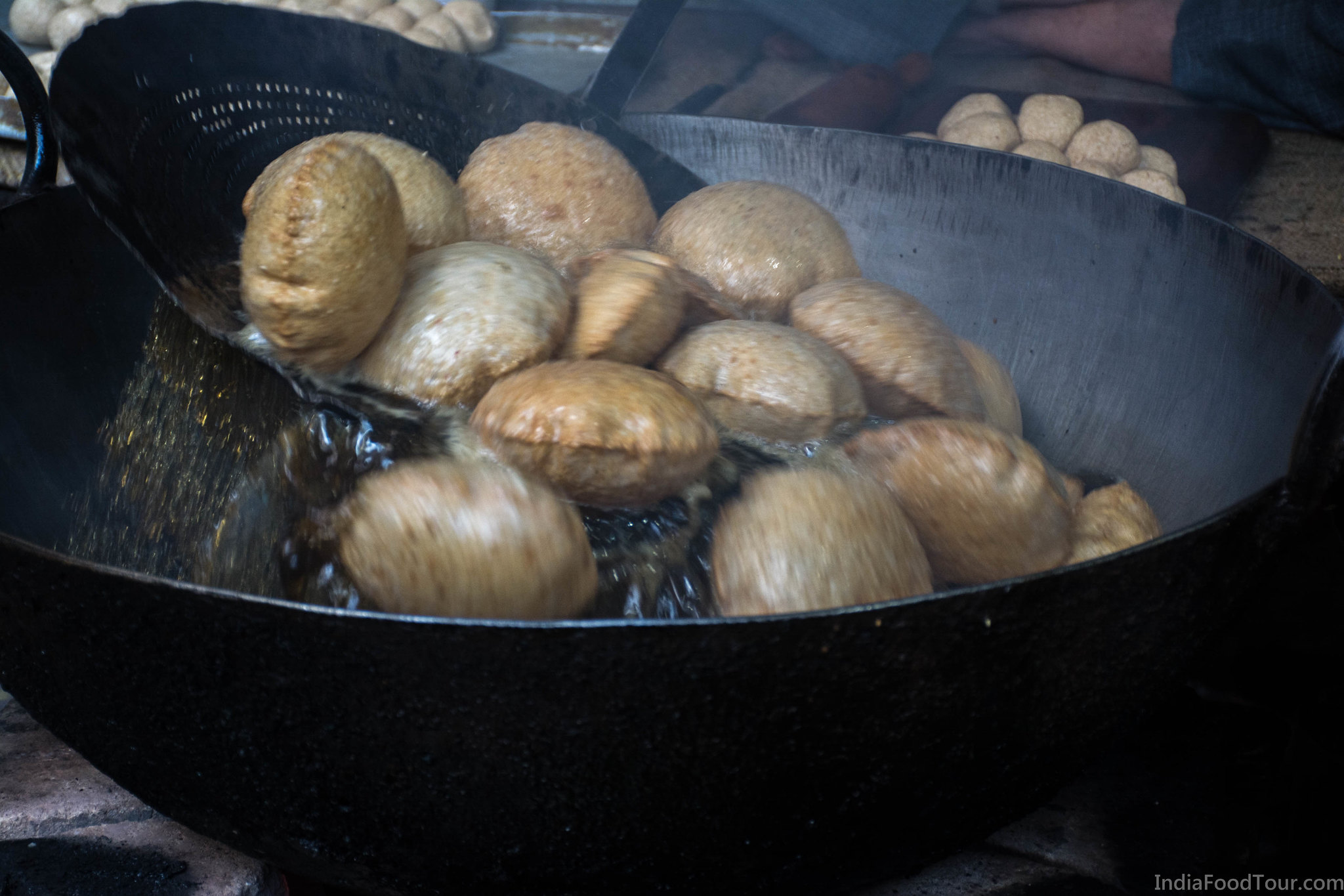 Fresh puris being cooked in Old Delhi