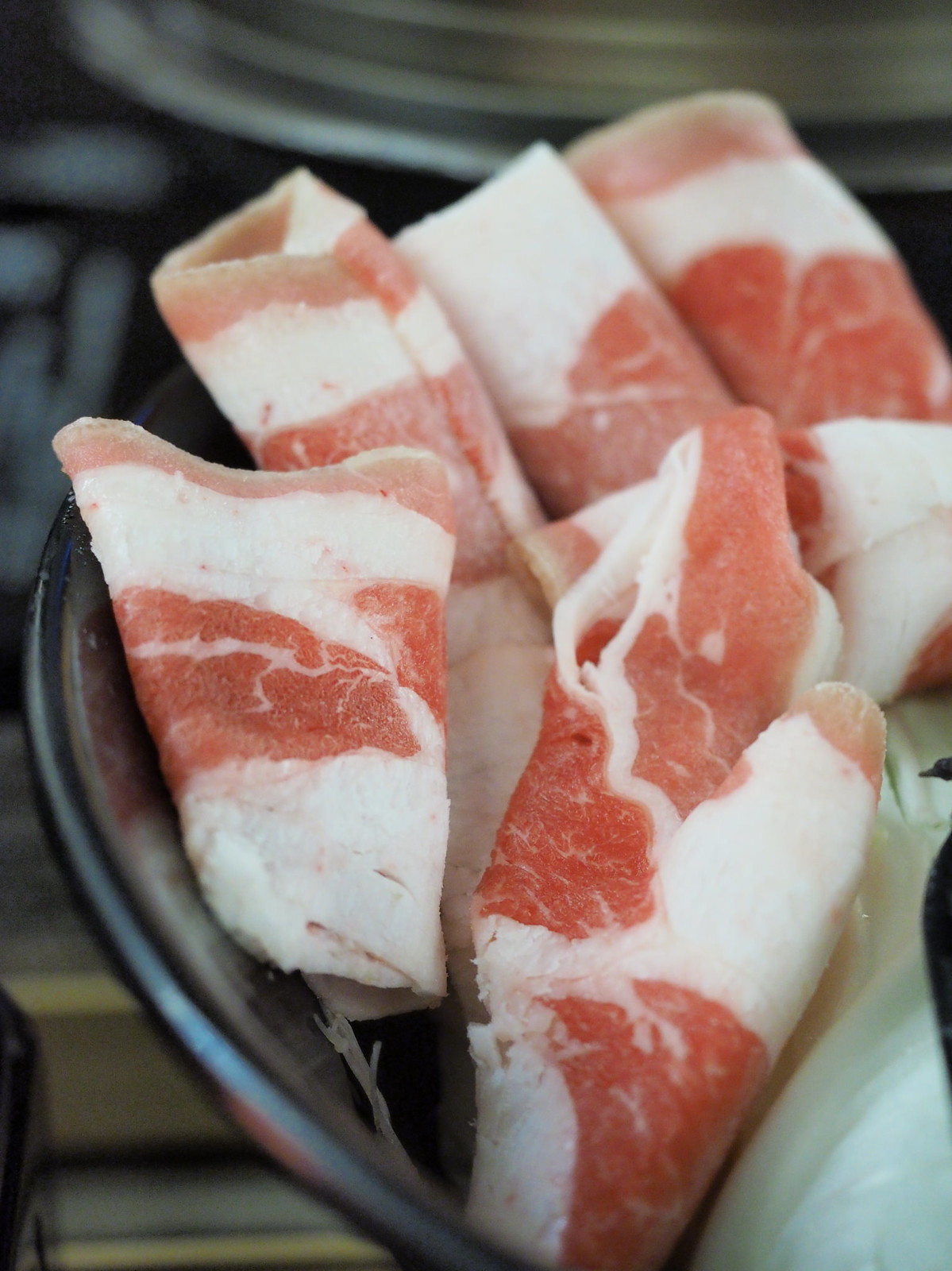 Fresh thin cut pork slices for the steamboat